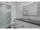 Updated bathroom with modern vanity, gray countertop, and walk-in shower at 2210 Utopian E Dr # 212, Clearwater, FL 33763