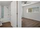 Bedroom with hardwood floors and access to bathroom at 2210 Utopian E Dr # 212, Clearwater, FL 33763