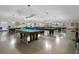 Well-lit billiards room featuring multiple pool tables at 2210 Utopian E Dr # 212, Clearwater, FL 33763