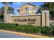 On Top of the World Paradise community entrance sign at 2210 Utopian E Dr # 212, Clearwater, FL 33763