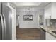 Bright dining area with hardwood floors and chandelier at 2210 Utopian E Dr # 212, Clearwater, FL 33763