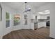 Bright dining area with kitchen access and modern light fixture at 2210 Utopian E Dr # 212, Clearwater, FL 33763