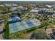 Expansive tennis courts with surrounding green space at 2210 Utopian E Dr # 212, Clearwater, FL 33763