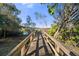 Scenic wooden bridge over a tranquil waterway at 2210 Utopian E Dr # 212, Clearwater, FL 33763