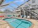 Relaxing poolside view, featuring a covered patio and comfortable seating at 3232 Gulf Coast Dr, Hernando Beach, FL 34607