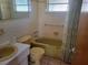 Clean bathroom with bathtub and shower at 3249 Trask Dr, Holiday, FL 34691