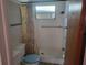 Bathroom with shower stall and window at 3249 Trask Dr, Holiday, FL 34691