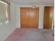 Bright bedroom with double door closet and ceiling fan at 3249 Trask Dr, Holiday, FL 34691