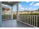 Front porch with white railing and view of neighborhood at 3411 Broken Bow Dr, Land O Lakes, FL 34639