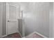 Upstairs hallway with a louvered door and carpet at 3411 Broken Bow Dr, Land O Lakes, FL 34639