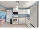 White cabinets and tile countertops highlight this well-lit kitchen at 403 48Th Street W Ct, Palmetto, FL 34221