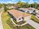 Aerial view of single Gathering home with driveway and landscaping at 4201 Silver Berry Ct, Spring Hill, FL 34609