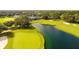 Aerial view of golf course with pond and clubhouse at 4201 Silver Berry Ct, Spring Hill, FL 34609