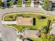 Aerial view of single-Gathering home with driveway and landscaped yard at 4201 Silver Berry Ct, Spring Hill, FL 34609