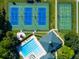 Three tennis courts, two pickleball courts, and pool at 4201 Silver Berry Ct, Spring Hill, FL 34609