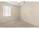 Empty bedroom with carpeted floor and a window with blinds at 4201 Silver Berry Ct, Spring Hill, FL 34609