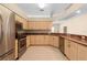 Kitchen features granite countertops and ample cabinetry at 4201 Silver Berry Ct, Spring Hill, FL 34609