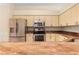 Modern kitchen with granite countertops and stainless steel appliances at 4201 Silver Berry Ct, Spring Hill, FL 34609