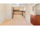 L-shaped kitchen with granite countertops and stainless steel appliances at 4201 Silver Berry Ct, Spring Hill, FL 34609