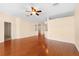 Hardwood floor living room with access to other rooms at 4201 Silver Berry Ct, Spring Hill, FL 34609