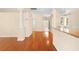 Hardwood floors and an open floor plan connect the kitchen and living areas at 4201 Silver Berry Ct, Spring Hill, FL 34609