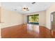 Living area with hardwood floors and sliding doors to patio at 4201 Silver Berry Ct, Spring Hill, FL 34609