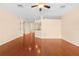 Spacious living room with hardwood floors and ceiling fan at 4201 Silver Berry Ct, Spring Hill, FL 34609