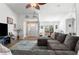 Living room with L-shaped sofa, entryway view and wall decor at 4527 Goldcoast Ave, Spring Hill, FL 34609