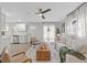 Open living room with a view of a modern kitchen and hardwood floors at 514 Donna Dr, Brandon, FL 33510