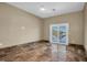 Bright bedroom with tile flooring and water views at 5517 Manatee Point Dr, New Port Richey, FL 34652