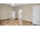 Bedroom with tile floors, access to bathroom and closet at 5517 Manatee Point Dr, New Port Richey, FL 34652