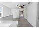 Upstairs hallway with carpet, ceiling fan and access to bedrooms at 6688 Back Forty Loop, Zephyrhills, FL 33541