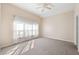 Bright bedroom with neutral walls and carpeted floor at 714 Sea Holly Dr, Brooksville, FL 34604