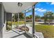 Cozy screened porch with view of the neighborhood at 7311 Coventry Dr, Port Richey, FL 34668