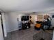 Spacious living room with tile flooring and large TV at 7552 Cumber Dr, New Port Richey, FL 34653