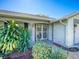 House entrance with decorative wrought iron double doors at 8500 Forest Glade Dr, Hudson, FL 34667