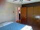 Bright bedroom with double bed and built-in closet at 8525 Gandy Ln, Port Richey, FL 34668