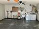 Garage with washer, dryer and storage at 8525 Gandy Ln, Port Richey, FL 34668