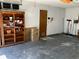 Garage with storage shelving and workbench at 8525 Gandy Ln, Port Richey, FL 34668