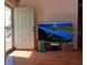 Living room featuring hardwood floors and access to the patio at 8525 Gandy Ln, Port Richey, FL 34668