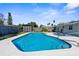 Relaxing kidney-shaped pool, perfect for summer days at 9121 Greenbriar Ln, Port Richey, FL 34668