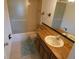 Bathroom with shower/tub combo and wood vanity at 9980 Eagles Point Cir # 3, Port Richey, FL 34668