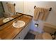 Bathroom with single sink vanity and toilet at 9980 Eagles Point Cir # 3, Port Richey, FL 34668