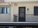 Close-up of condo building's entrance and balcony at 9980 Eagles Point Cir # 3, Port Richey, FL 34668