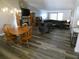 Open living and dining area with fireplace and laminate flooring at 9980 Eagles Point Cir # 3, Port Richey, FL 34668