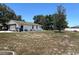 Large backyard featuring a home and a garage at 1000 Godfrey Ave, Spring Hill, FL 34609