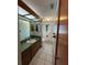 A charming bathroom with a full vanity, toilet, and a bathtub at 1000 Godfrey Ave, Spring Hill, FL 34609