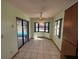 Cozy dining area with bay window, tile floors, sliding door access to the pool at 1000 Godfrey Ave, Spring Hill, FL 34609