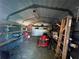 Spacious garage featuring ample storage and a well-lit interior for various equipment and tools at 1000 Godfrey Ave, Spring Hill, FL 34609