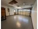Expansive garage with a smooth concrete floor, natural light, and convenient door access for easy parking at 1000 Godfrey Ave, Spring Hill, FL 34609